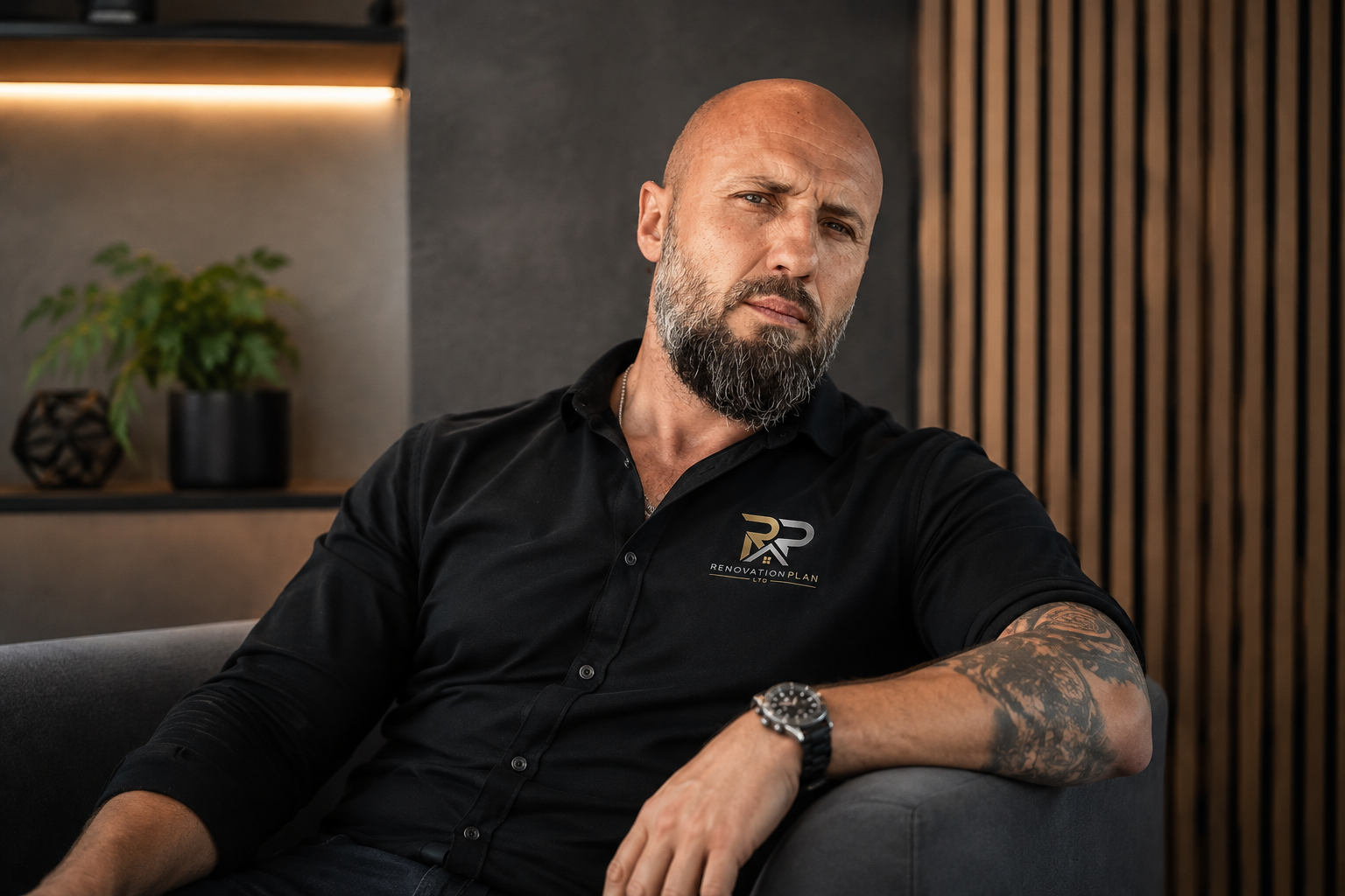 Gabriel Stano in RenovationPlanltd branded workwear in a completed living room