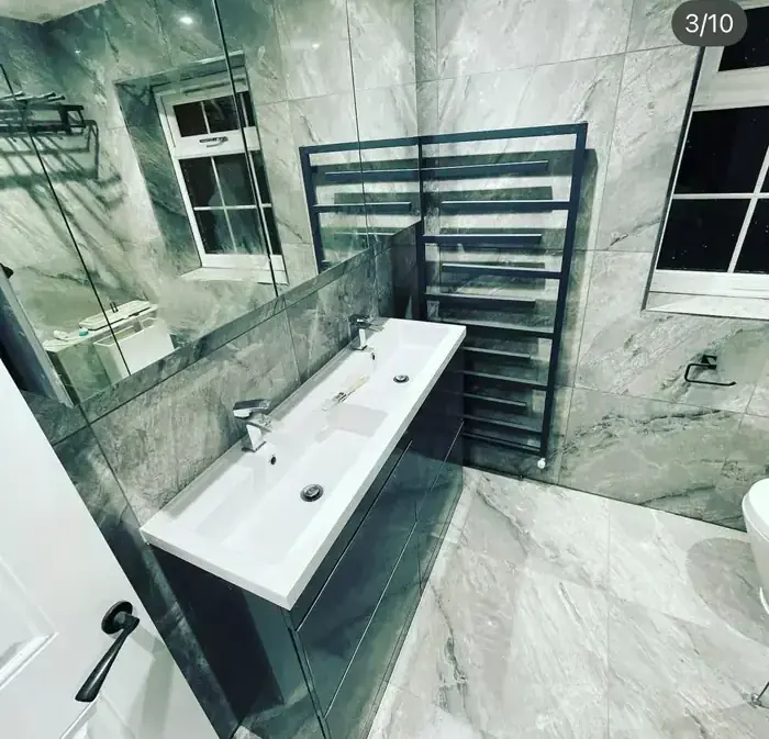 Marble-effect porcelain bathroom refit by RenovationPlanltd in Bishop's Stortford
